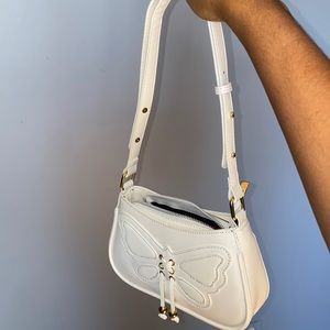 White shoulder bag.